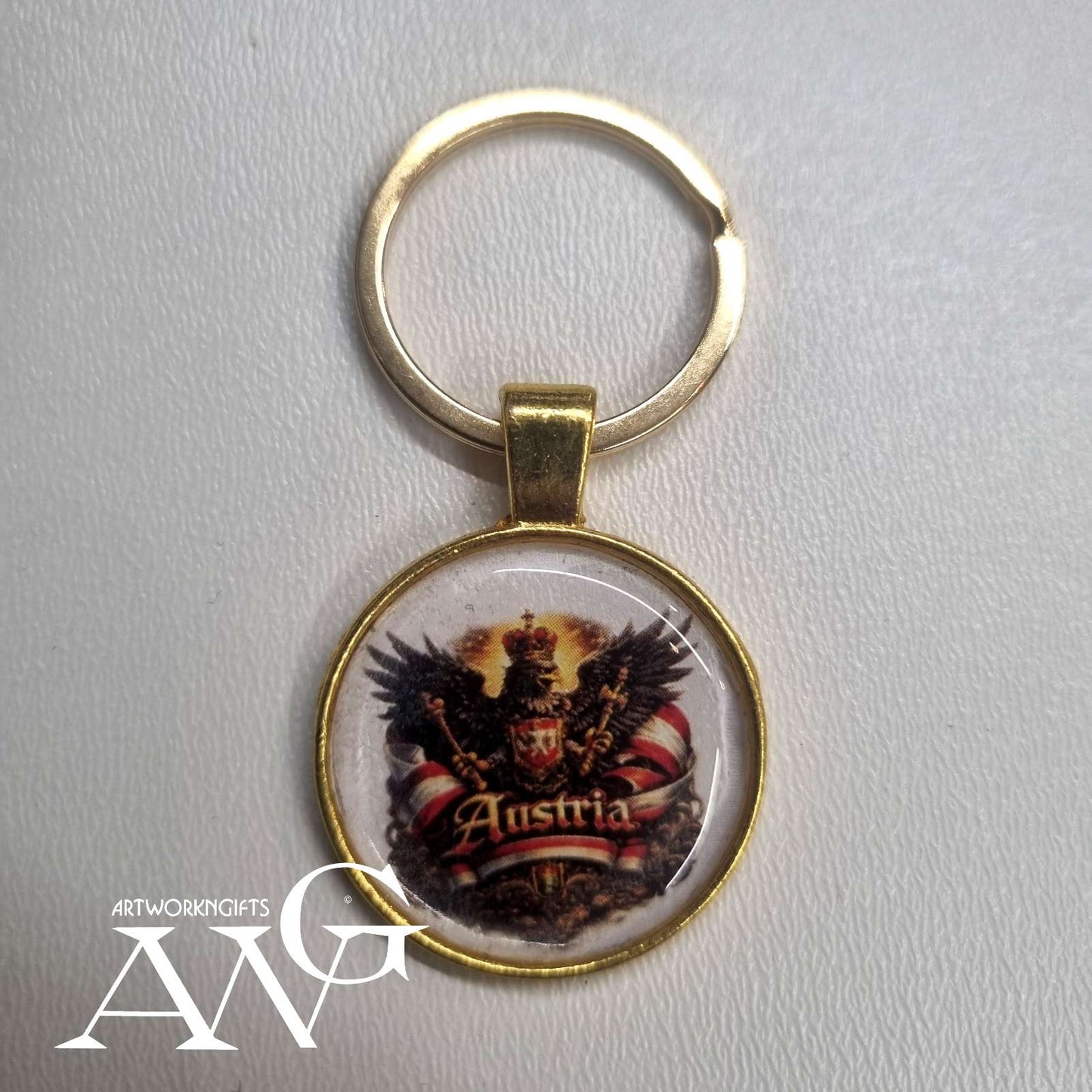Austrian eagle emblem and the word "Austria". Handmade necklace keychain 25 mm gold