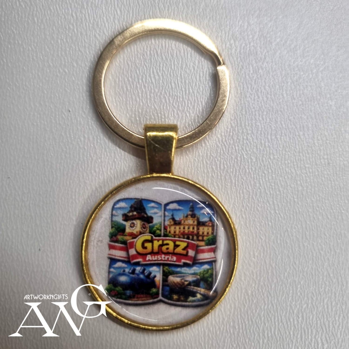 Graz, Austria souvenir keychain featuring iconic city landmarks. Handmade necklace keychain 25 mm gold